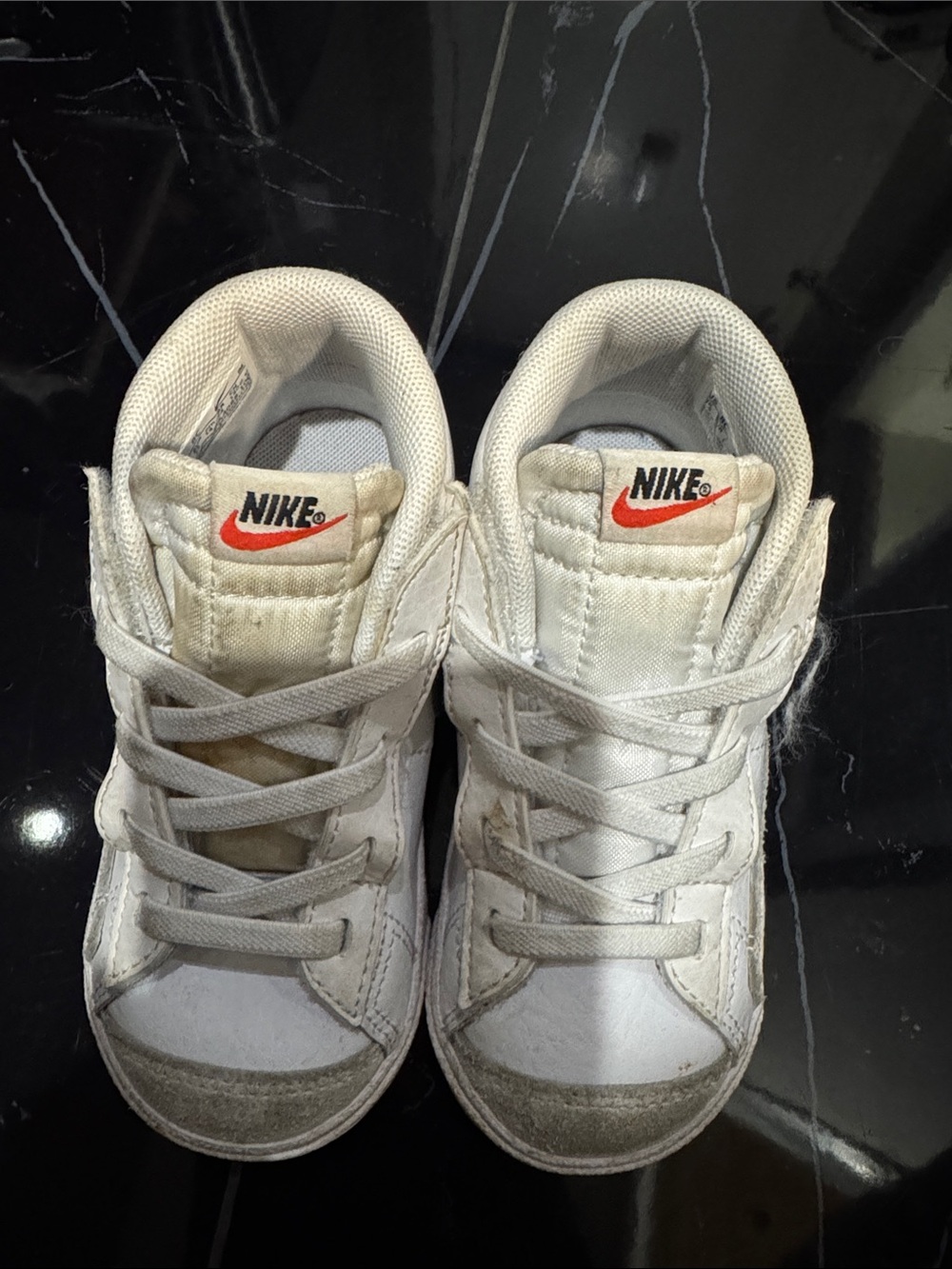 Nike White Kids High-Top Sneakers with Orange Swoosh